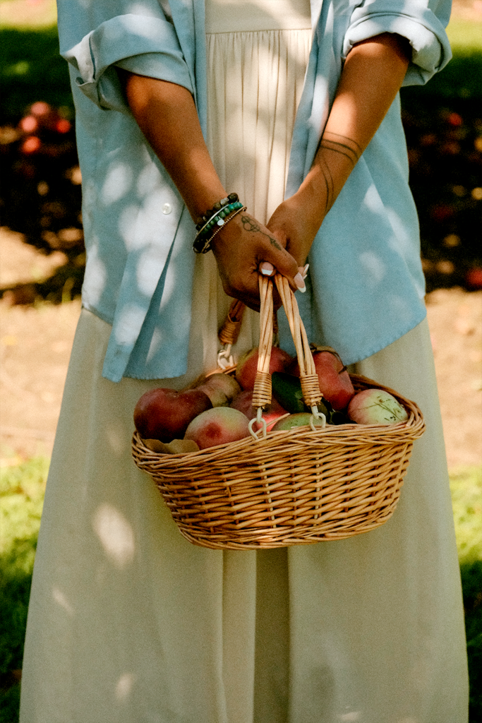 Closeup of woman holding an apple basket from a photo session at an Ottawa apple orchard